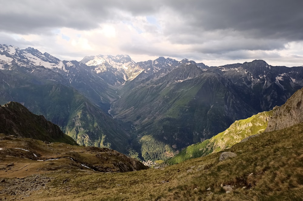 a view of a mountain range with a cloudy sky