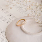 A delicate porcelain music box adorned with hand-painted floral designs and a tiny ballerina inside.