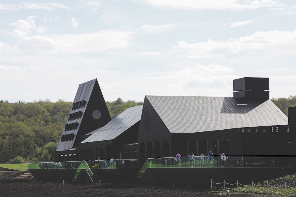 black and gray wooden house under white sky during daytime