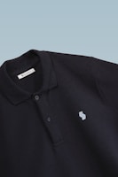 Detailed shot of a company name embroidered on a polo shirt.