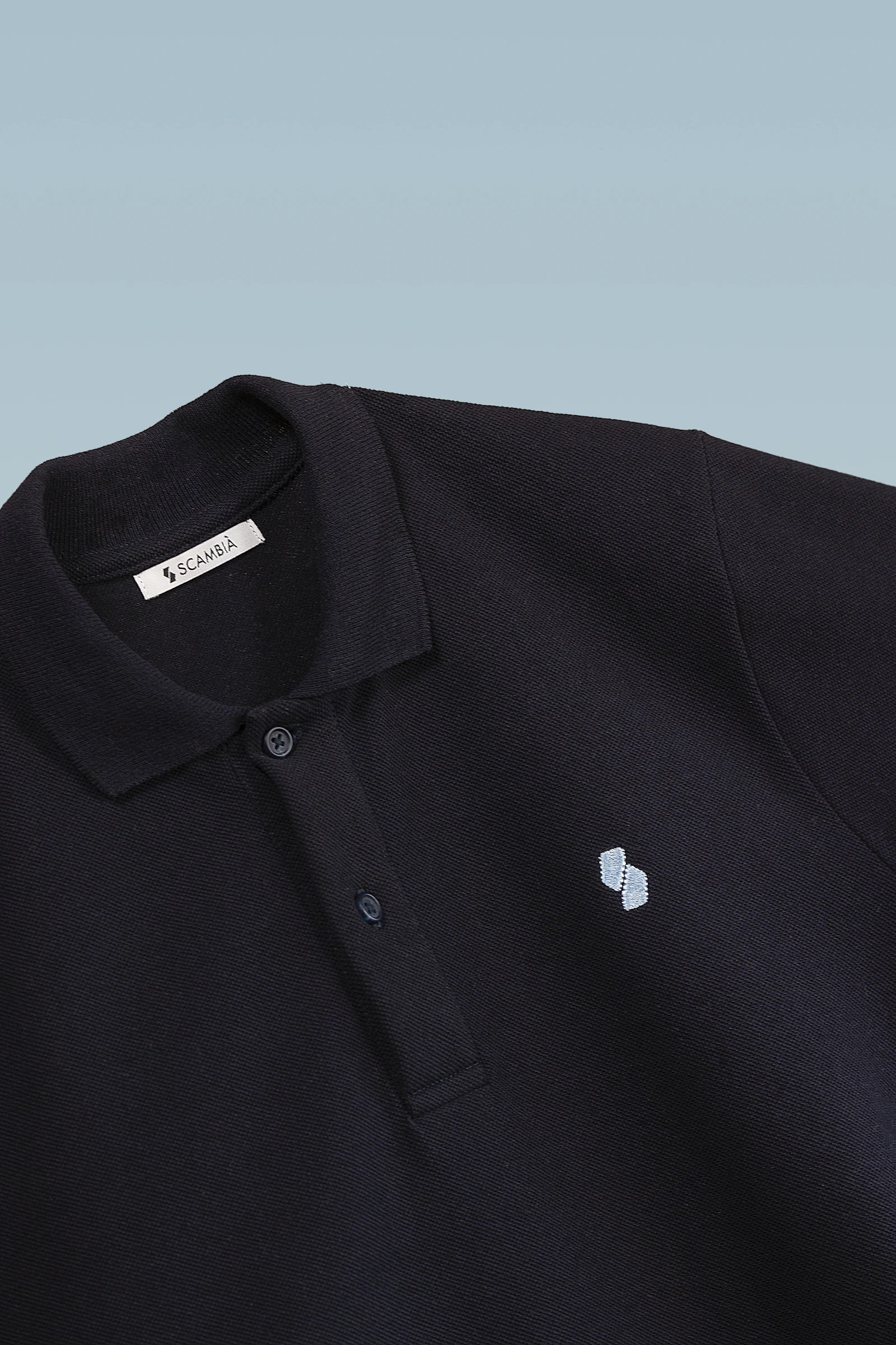 Black pique polo shirt flat