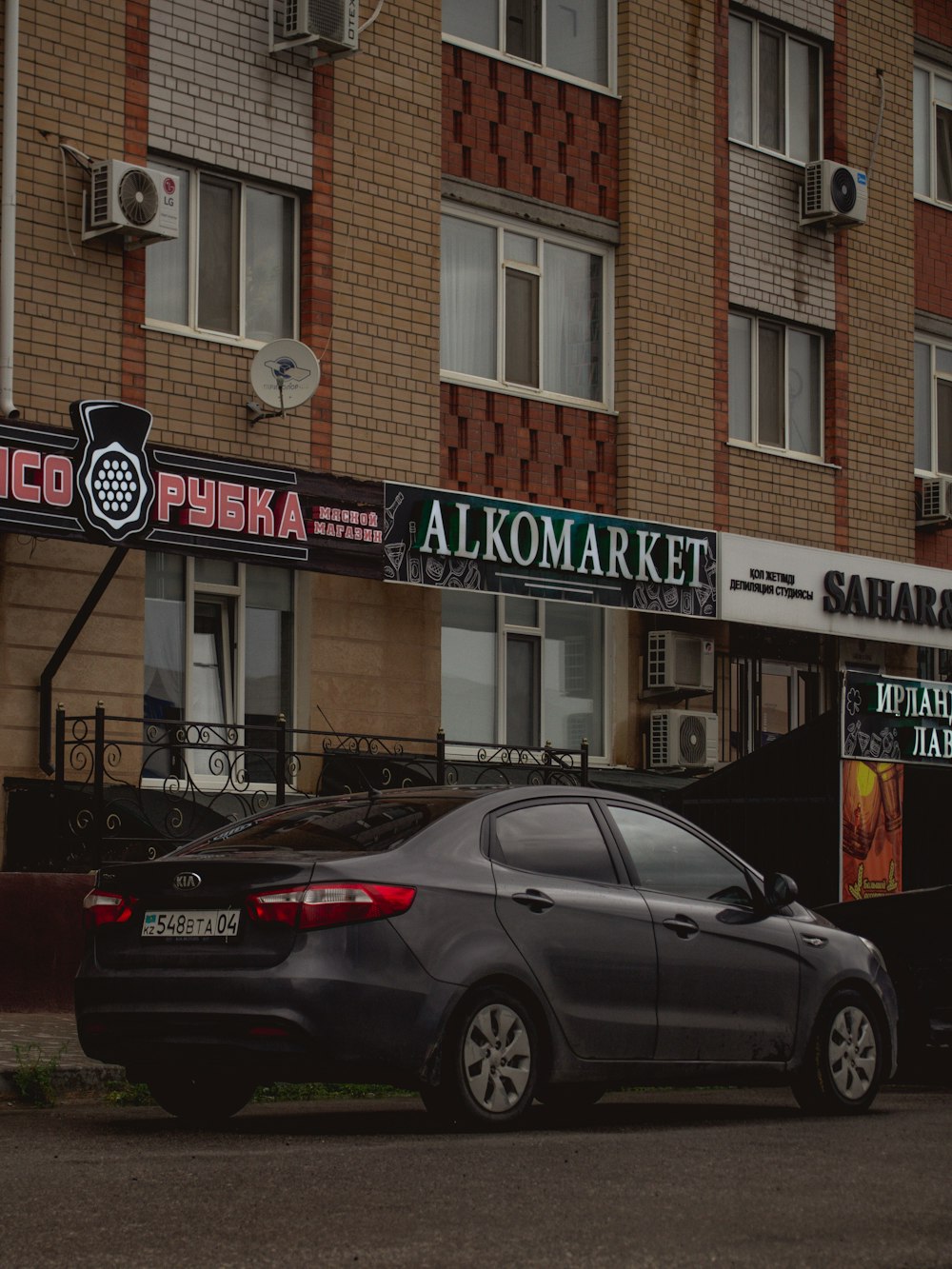 black sedan parked in front of UNKs restaurant