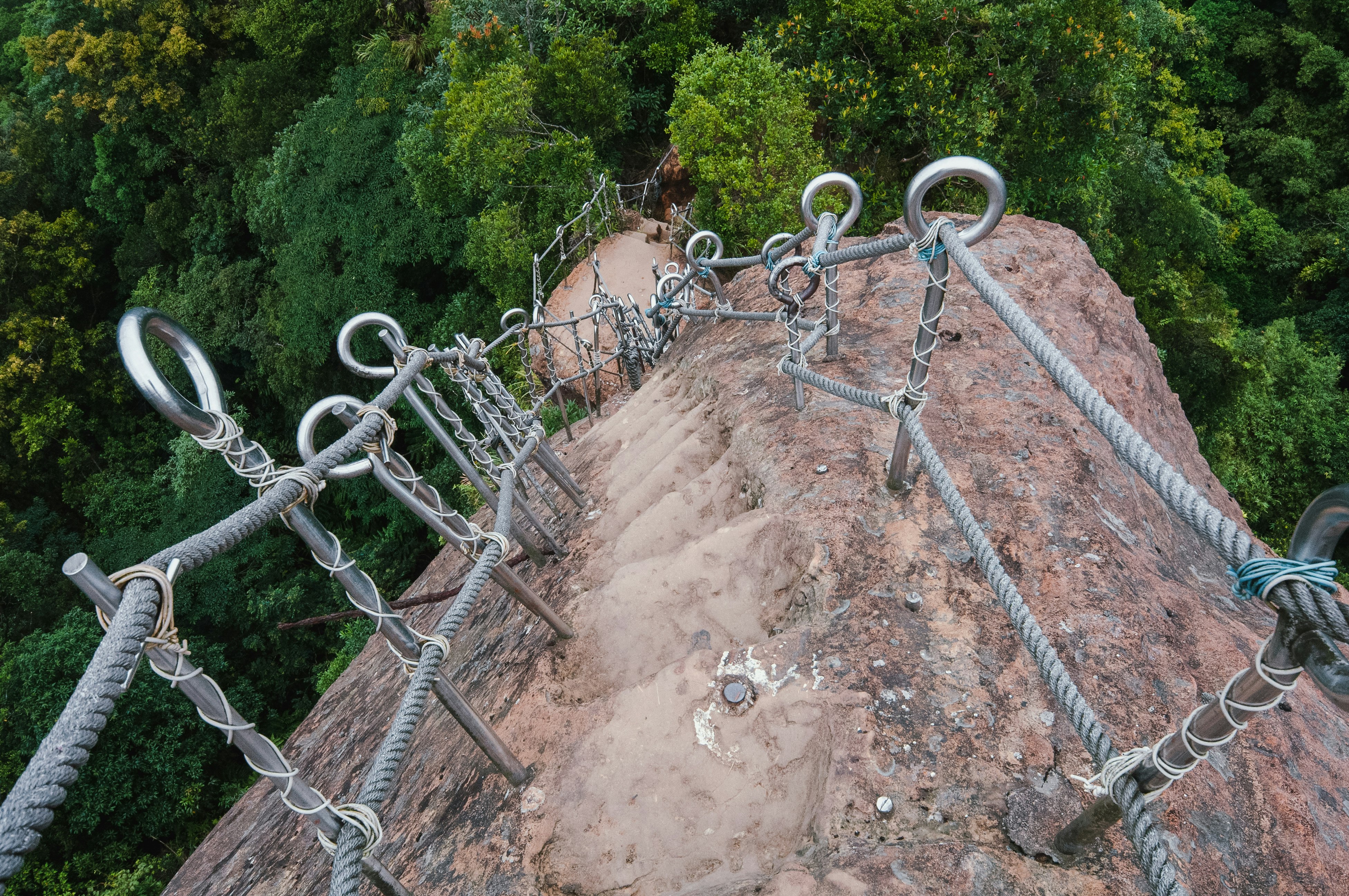 gray metal fence on brown soil