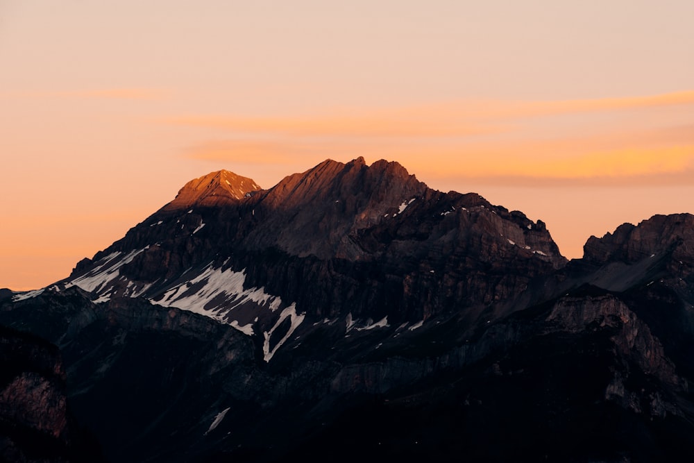 snow covered mountain during daytime