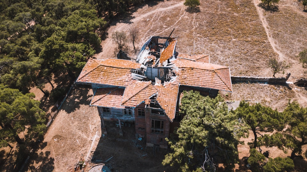 brown and white house on hill