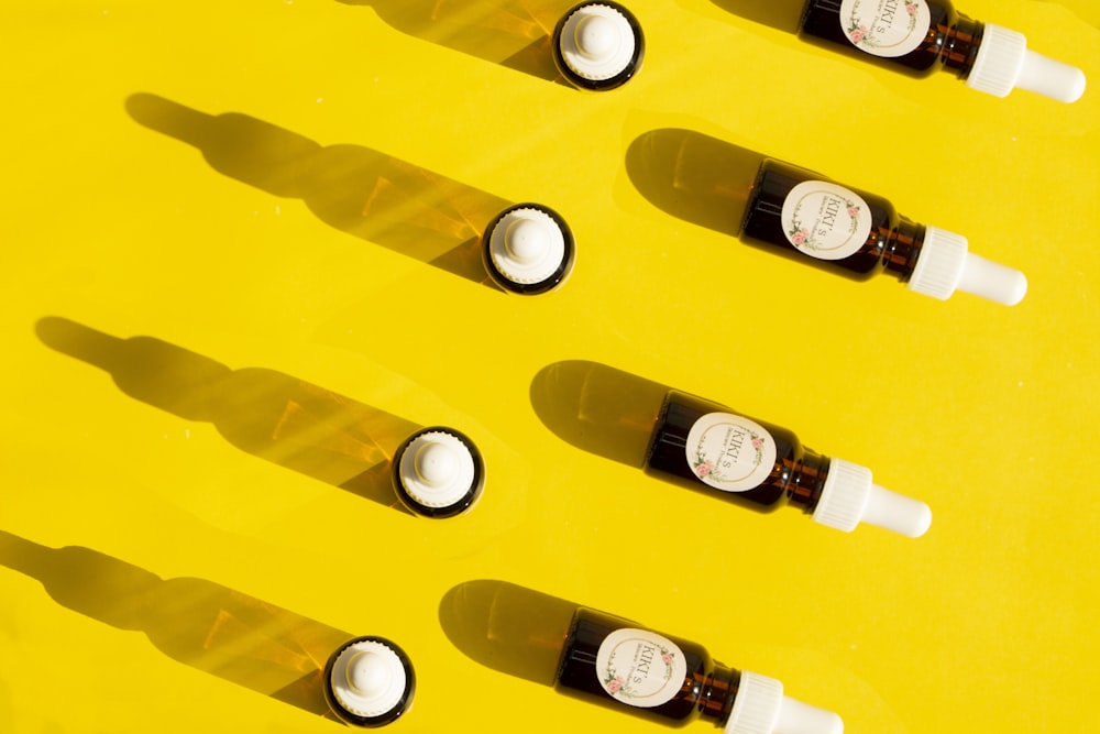 white labeled bottles on yellow plastic container