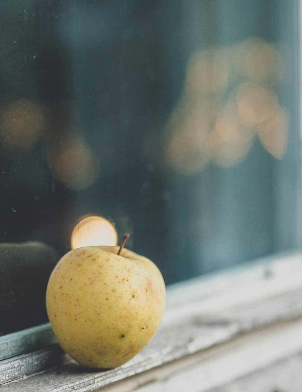 yellow apple fruit on black table