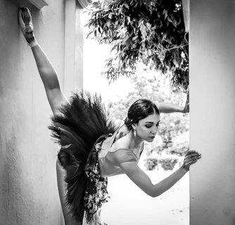 woman in black and white floral spaghetti strap dress