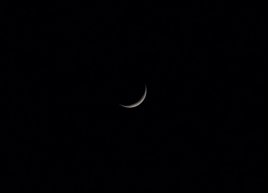 white crescent moon on black background