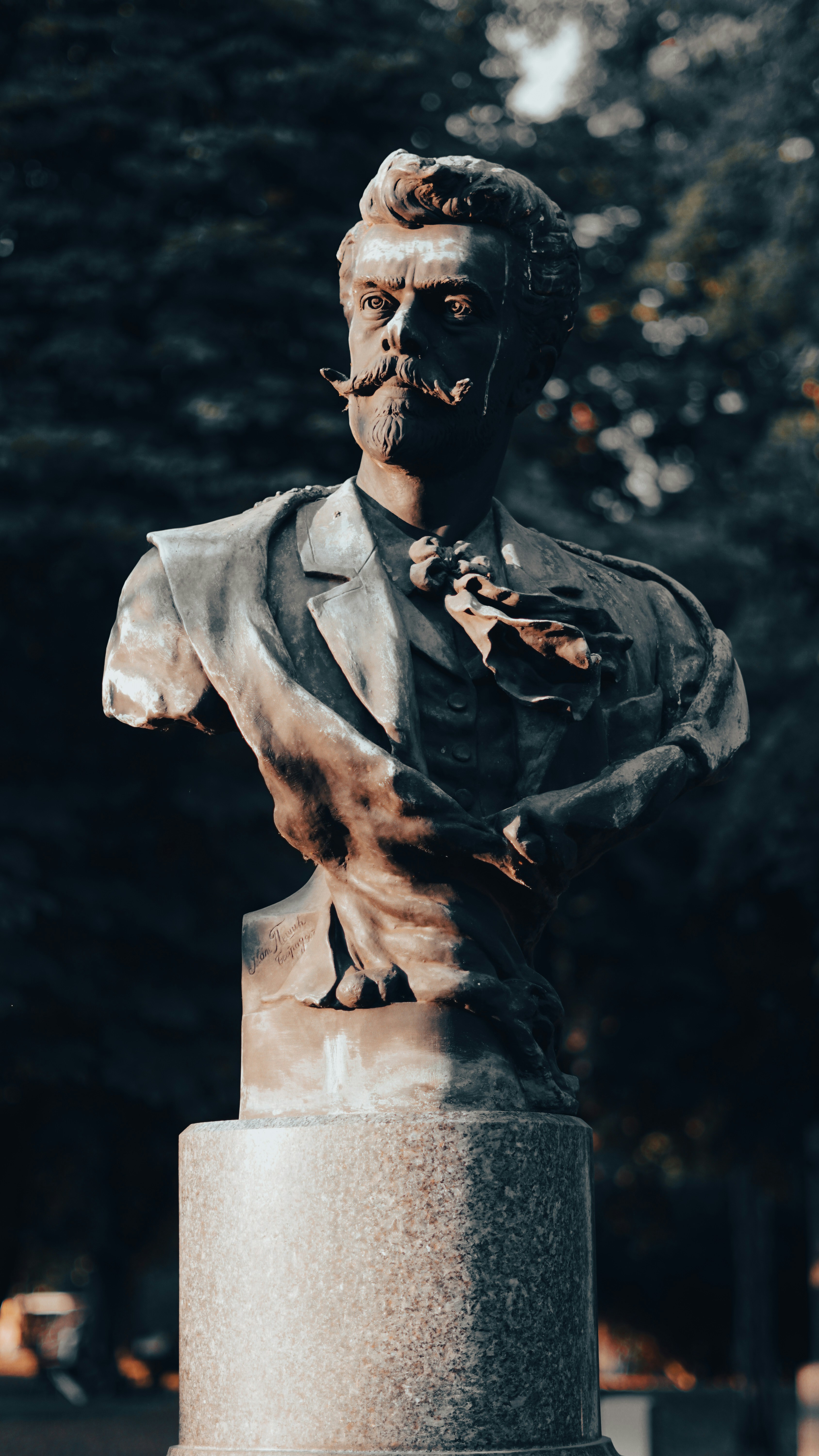 man in black suit statue