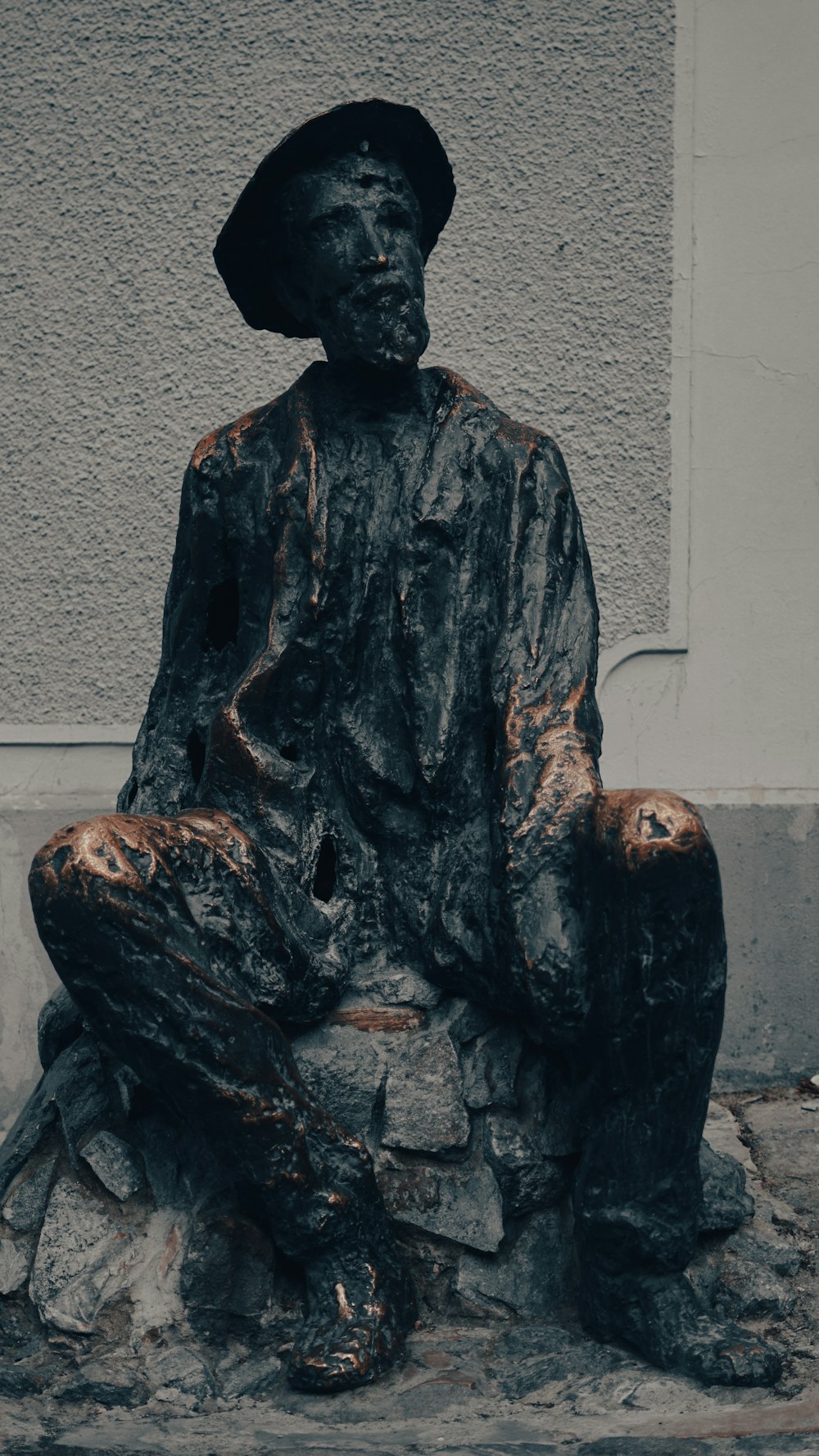 man in black and brown coat statue