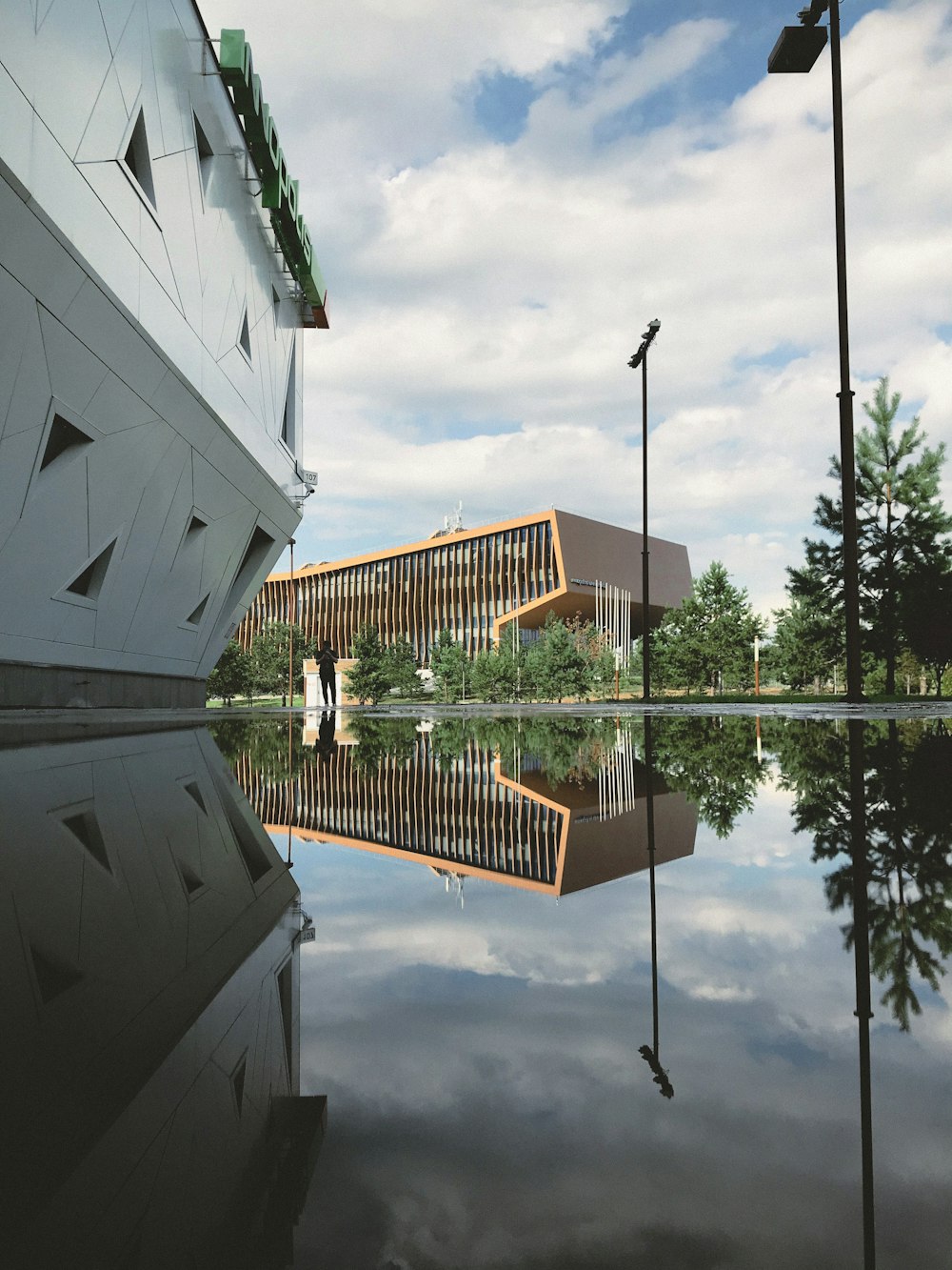 white and brown concrete building near body of water during daytime