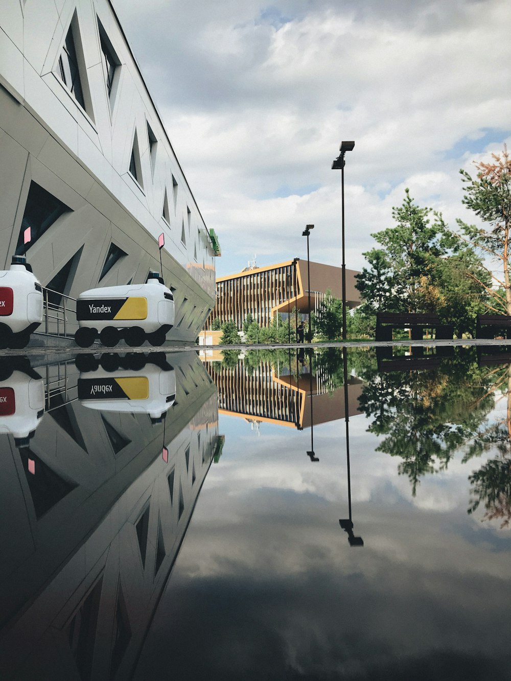 white and brown concrete building near body of water during daytime