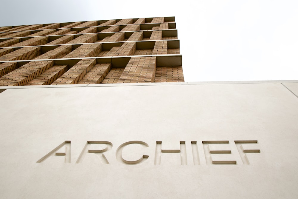 low angle photography of brown concrete building