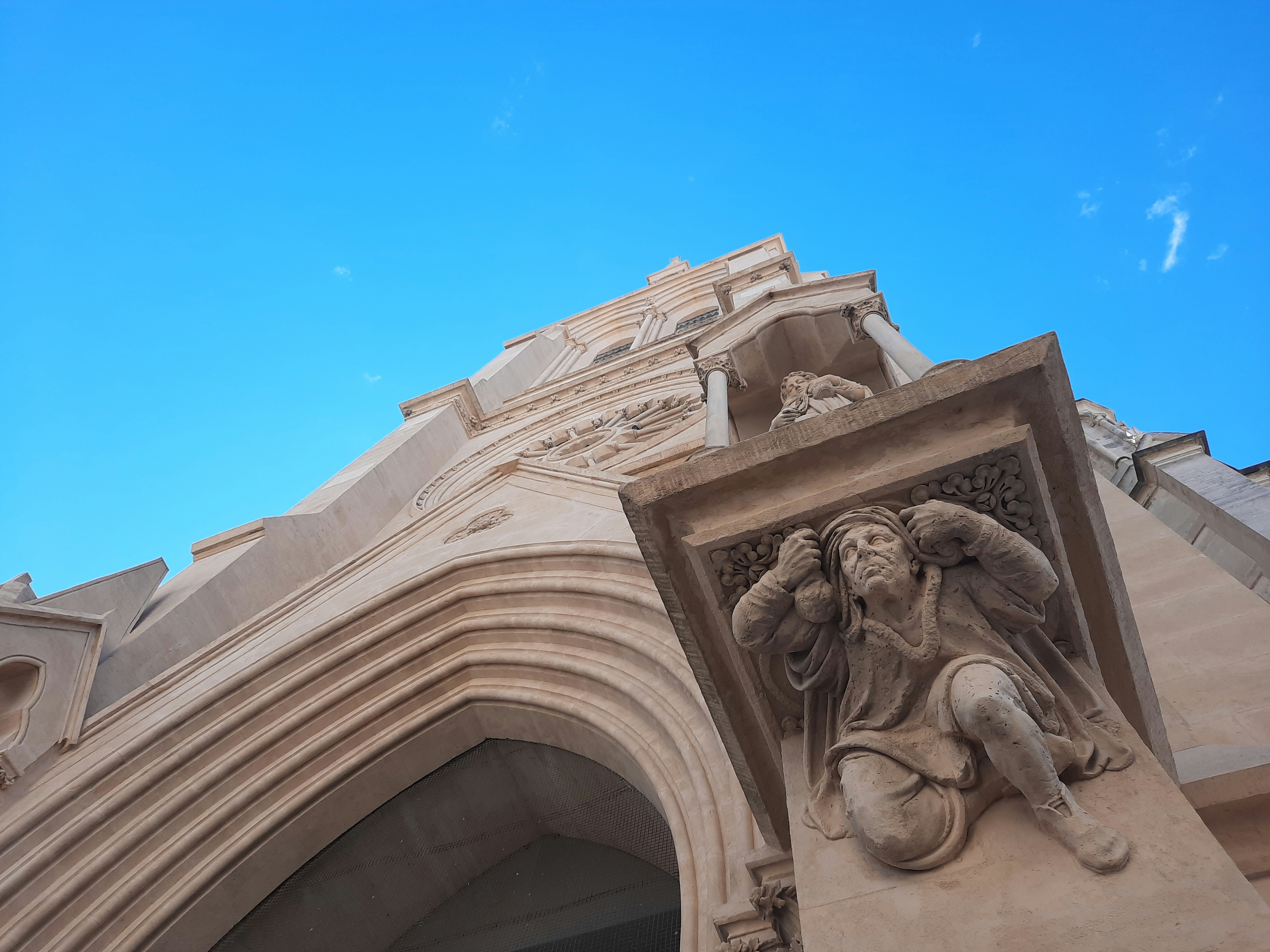 white concrete building under blue sky during daytime