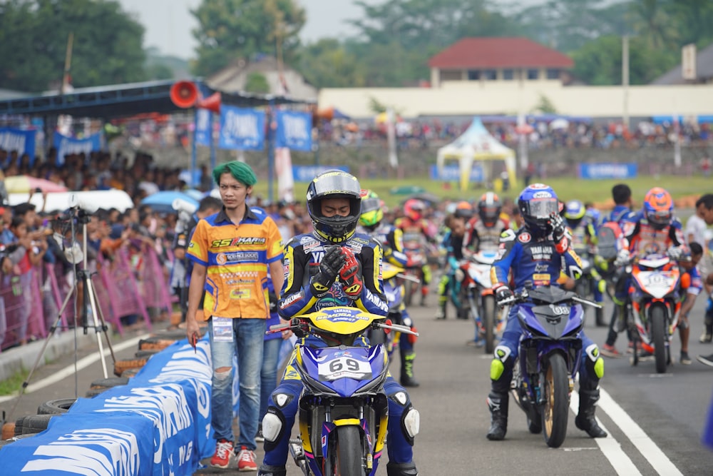 people riding motorcycle on road during daytime