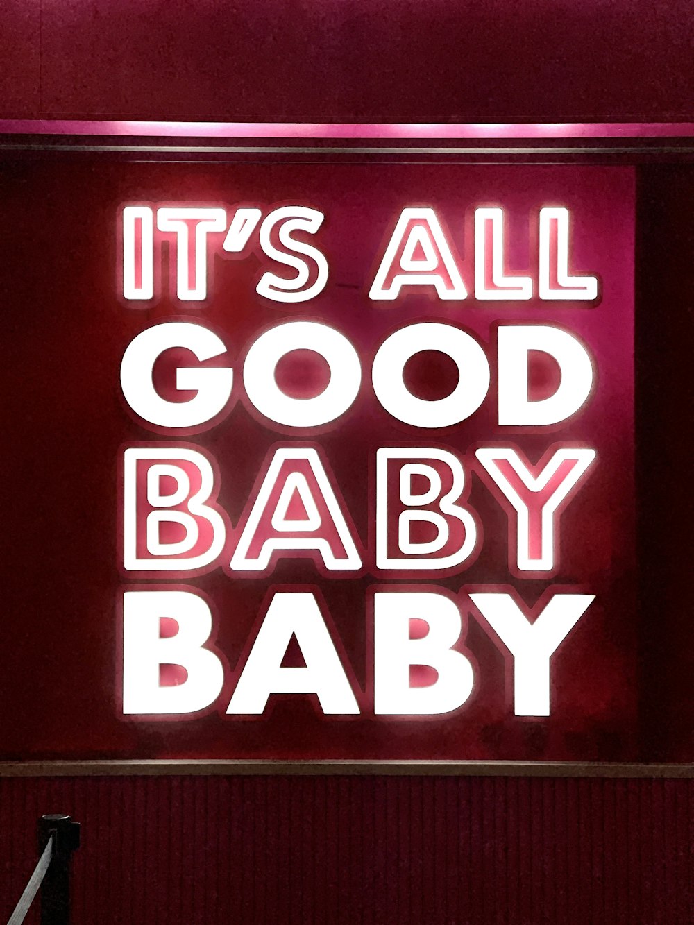 a neon sign that says it's all good baby baby