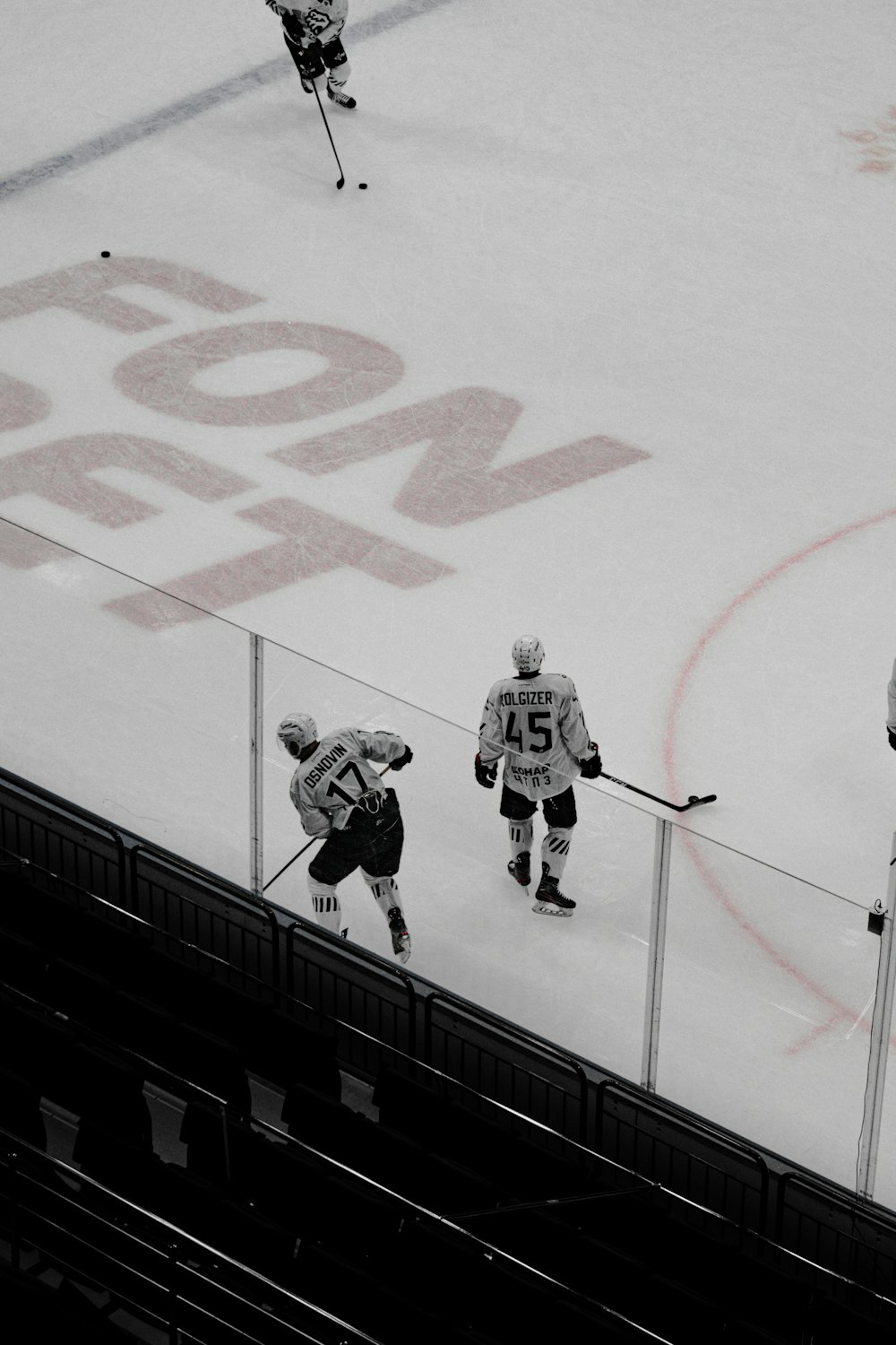 2 men playing ice hockey