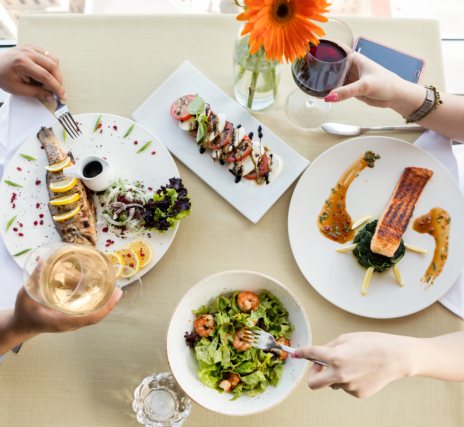 Person holding fork and knife slicing a beautifully plated dish at home.