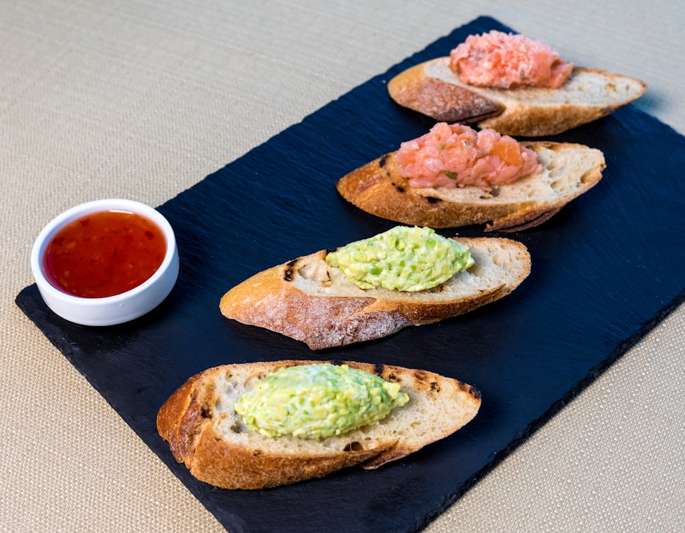 bread with green vegetable on brown wooden table
