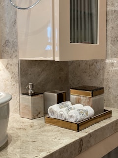 white ceramic sink near white ceramic toilet bowl
