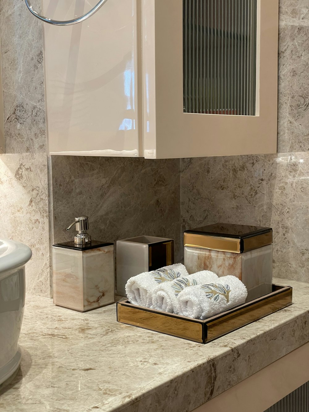 white ceramic sink near white ceramic toilet bowl