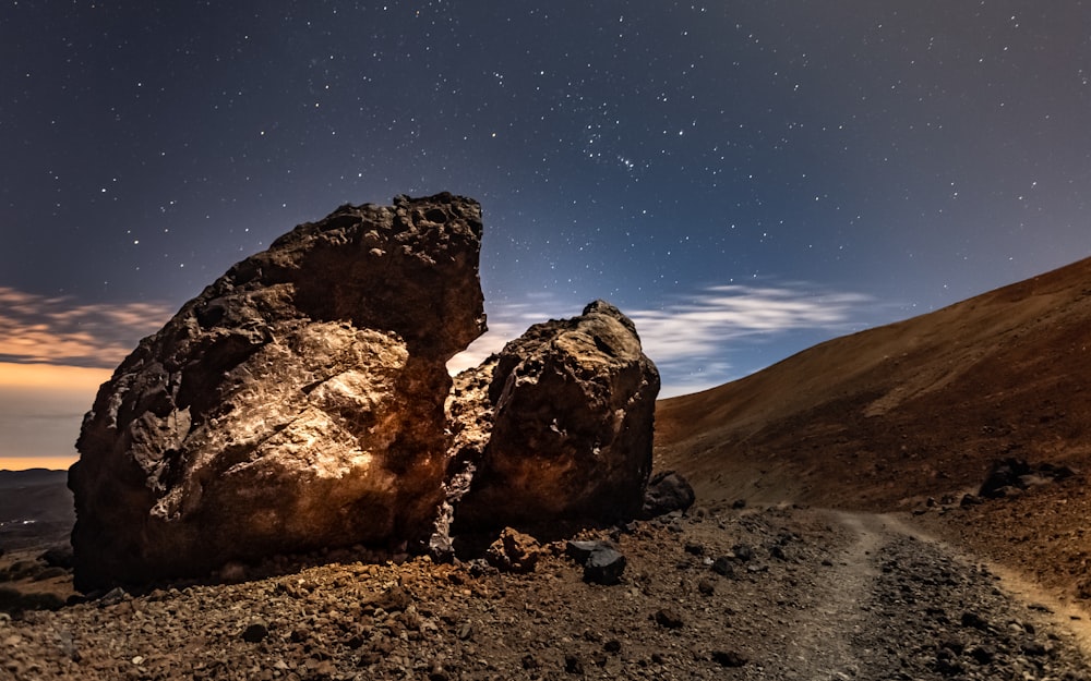 brown rock formation under blue sky during daytime