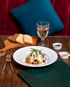 Close-up of a rustic French dish beautifully plated with fresh herbs.