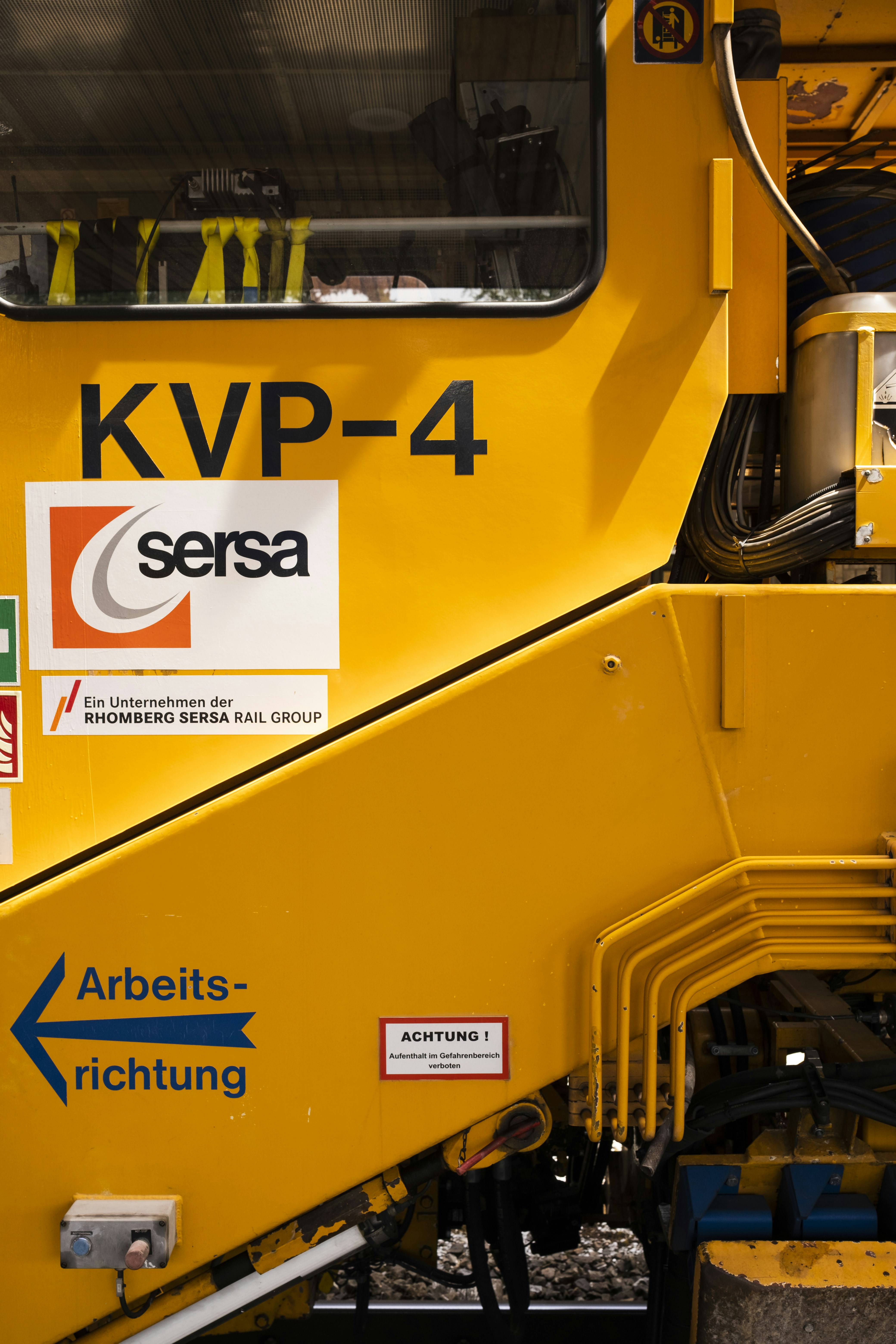 a close up of the front of a yellow train