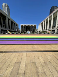 Open public plaza with minimalist architectural elements and community gathering.