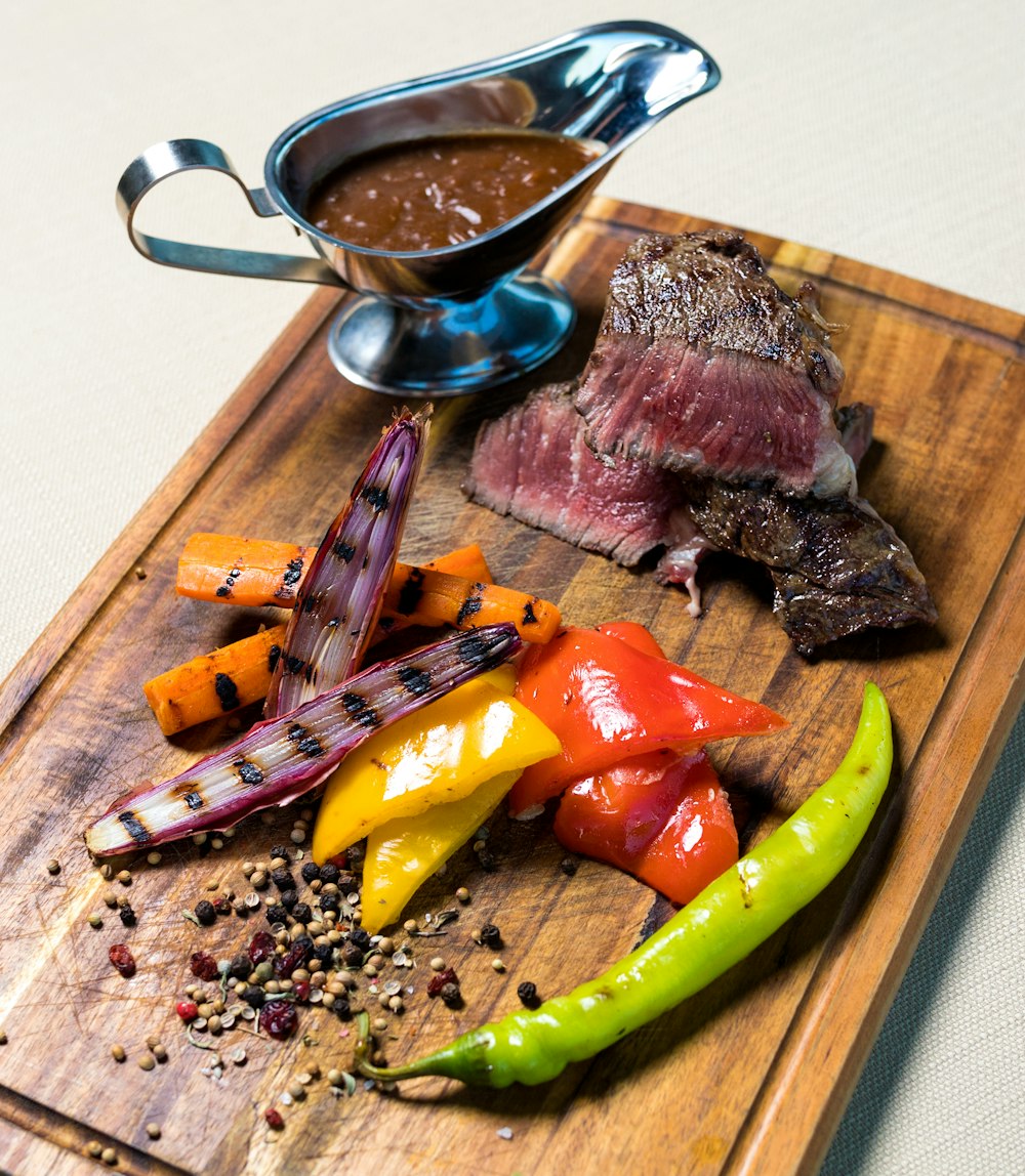 raw meat on green chopping board