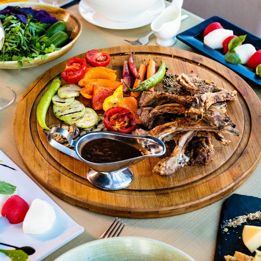 cooked food on brown wooden round plate