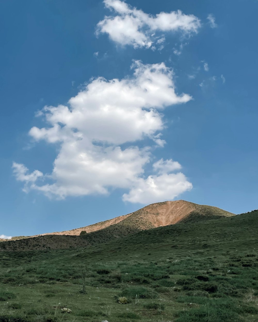 brown mountain under blue sky during daytime