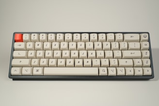 white computer keyboard on white surface