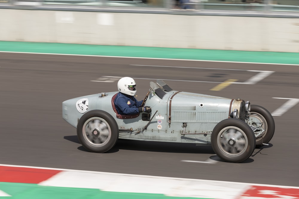 white and red racing car on track