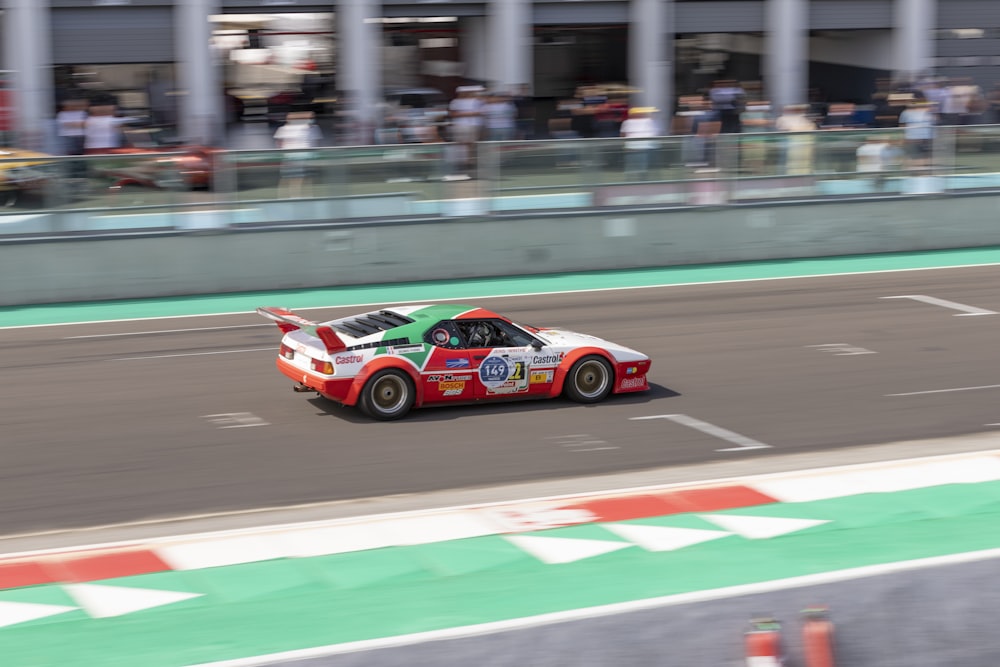 red and black racing car on track