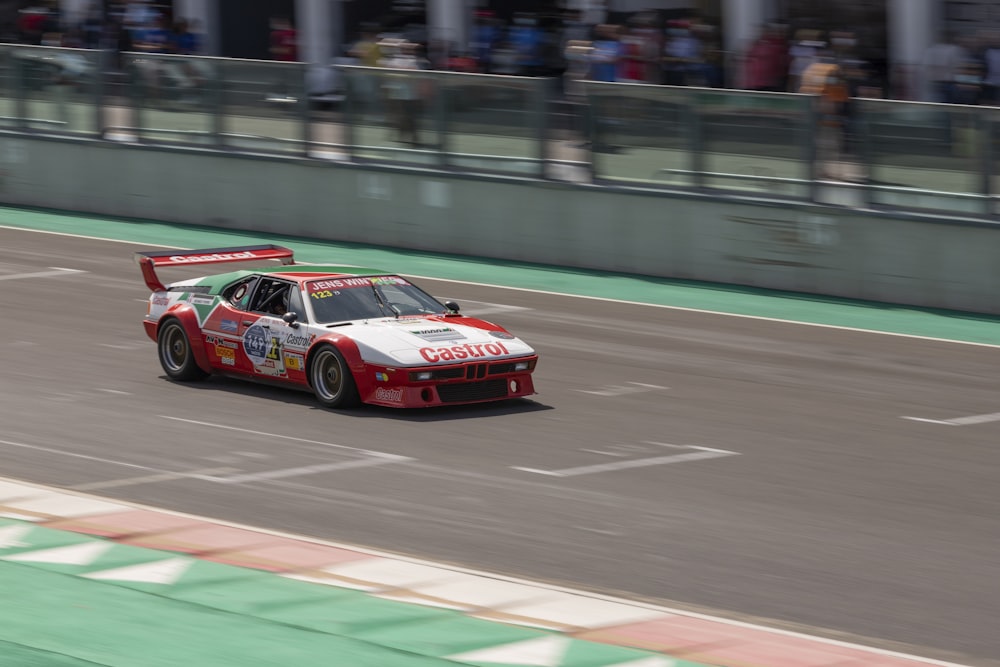 red and black chevrolet camaro on track