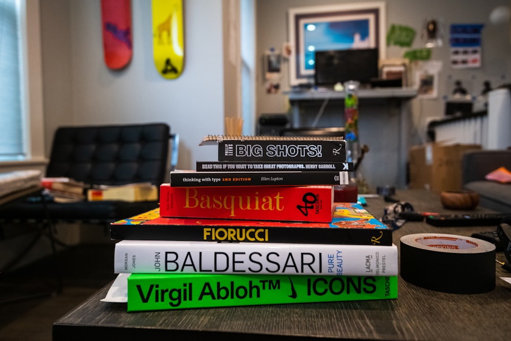 red and black books on green table