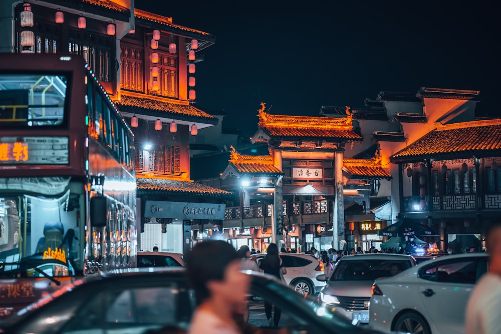 people walking on street during night time