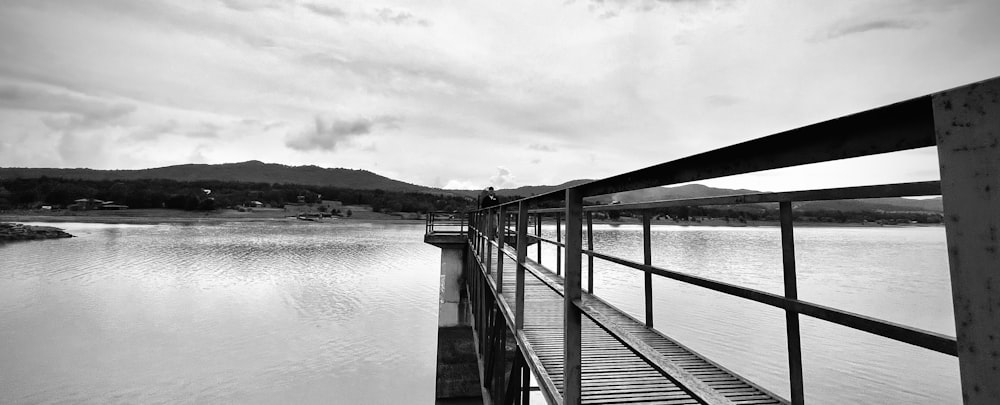 grayscale photo of wooden dock