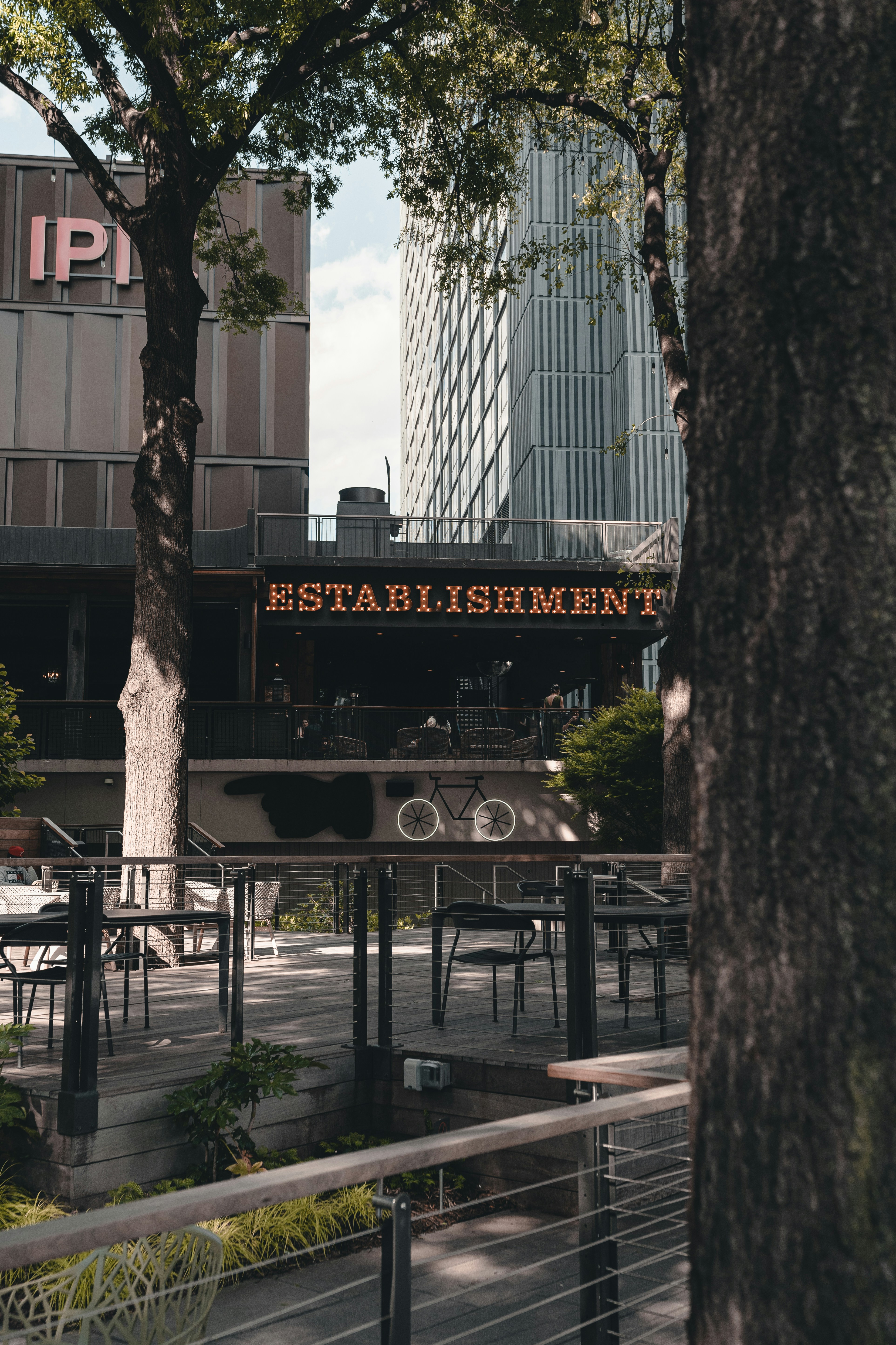 black metal fence near black and white building during daytime