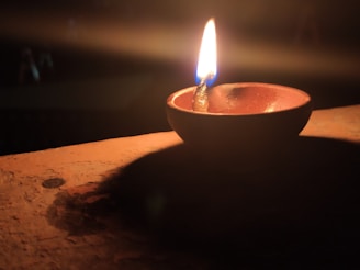 A peaceful evening scene with soft cushions and a glowing lamp, inviting a sense of comfort and calm.