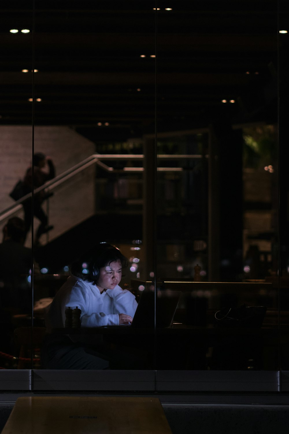 man in white dress shirt sitting on chair