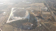 Aerial view of a multi-use sports facility under construction, showcasing modern design and layout.