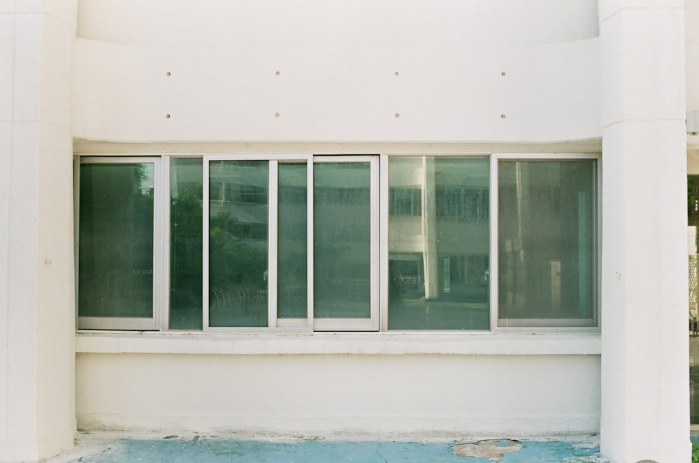 white wooden framed glass window