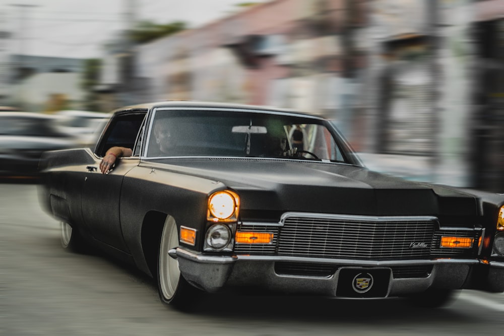 black mercedes benz coupe on road during daytime