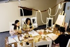 people sitting at table with food on table