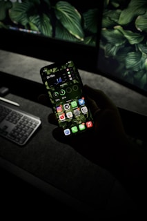 black android smartphone turned on displaying game application