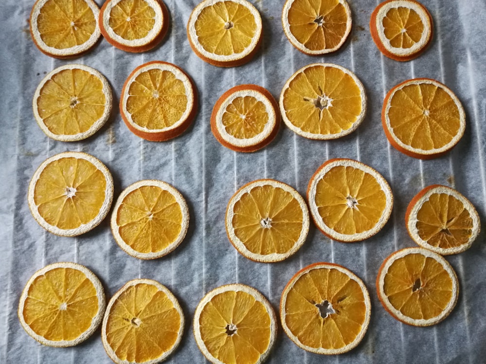 orange fruits on white surface