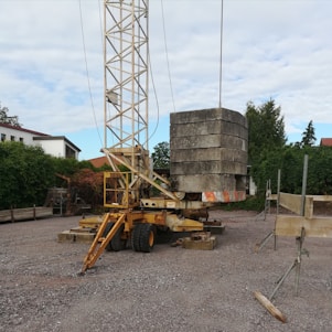 A modern boom lift in action at a construction site.